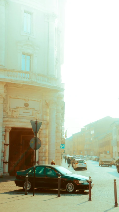 an old po of an older car parked in front of a building