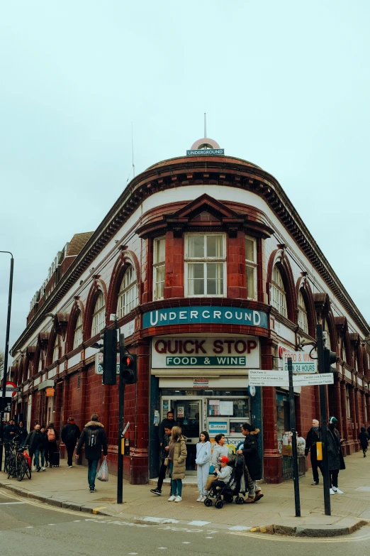 a group of people are standing outside of a building