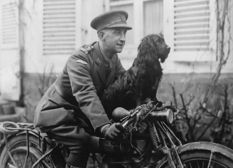 this is an image of a man on a bike with his dog