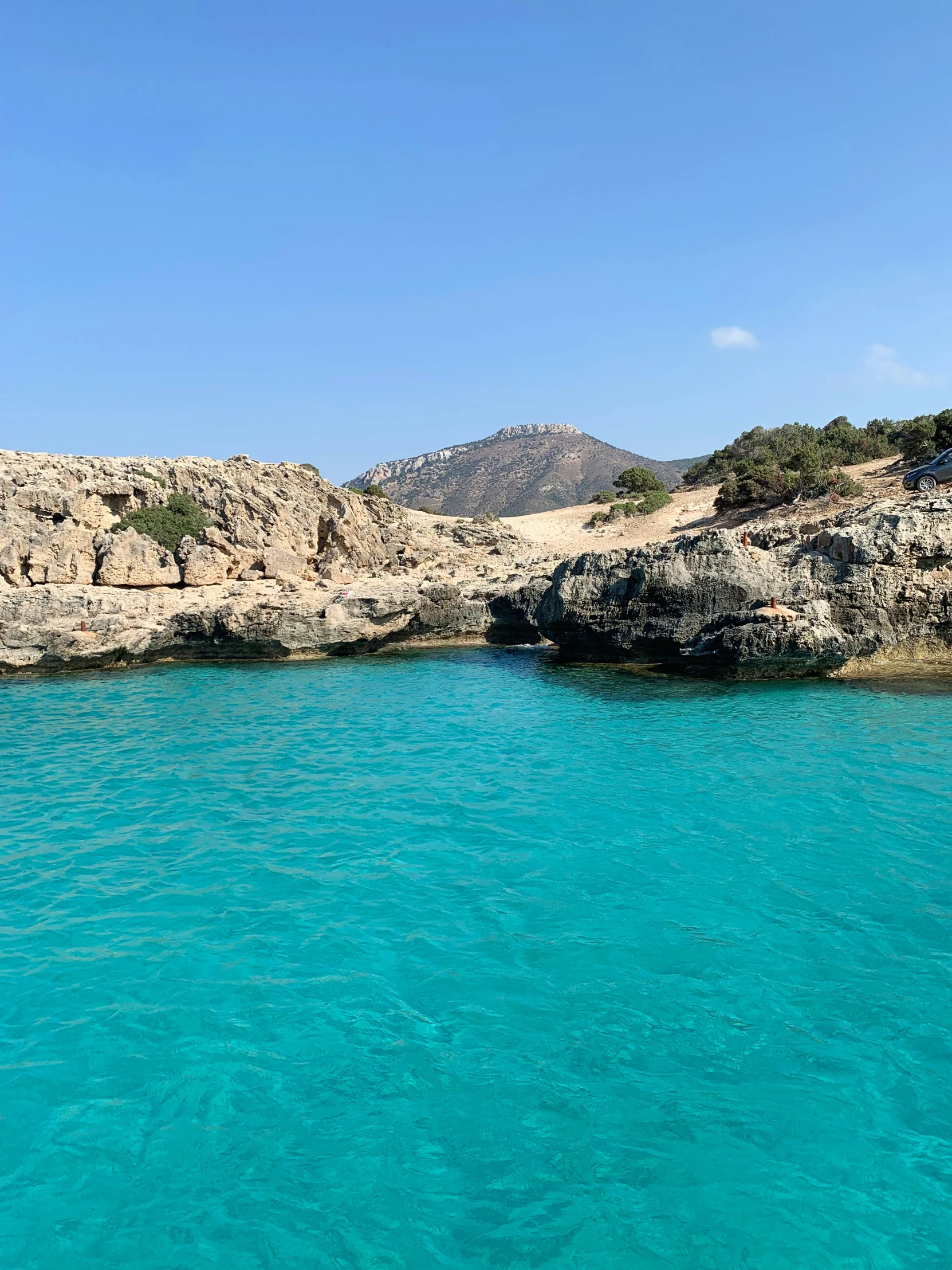 a water boat sits in a shallow bay