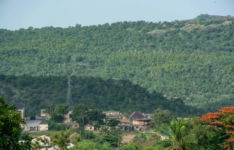 the view over a hill with houses in the distance