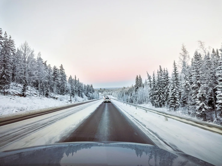 the view from a car that is driving down a road