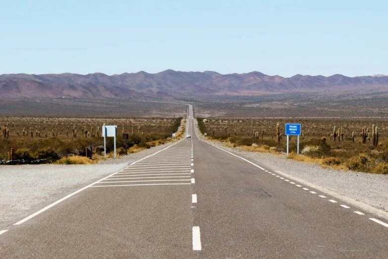 a large road in the middle of some big deserts