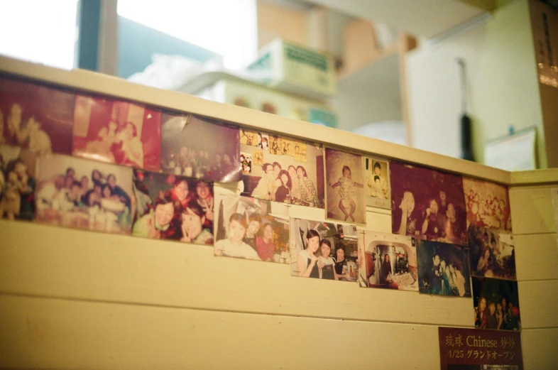 a wall is covered with a wall mounted po album