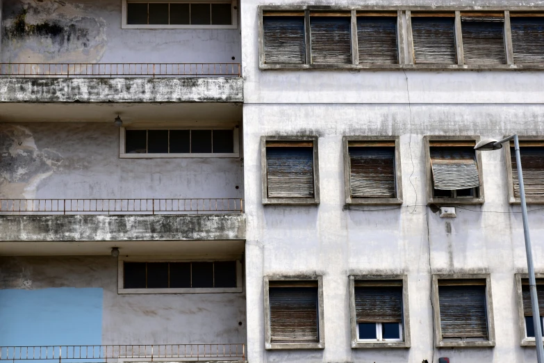 the old buildings are full of windows and balconies