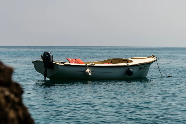 a lone boat is seen out in the open ocean