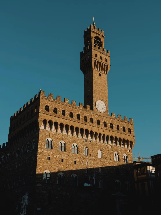 this building has a large tower with a clock on it