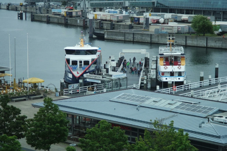 two boats are parked next to each other in the water