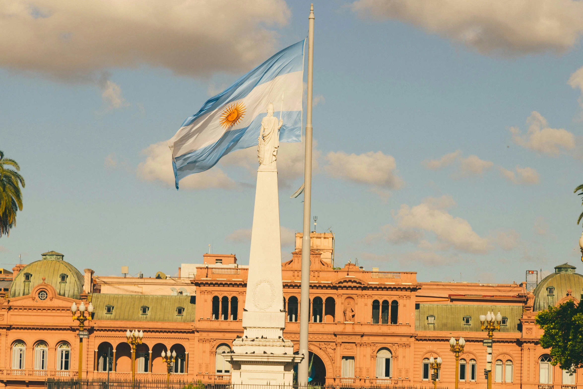 a flagpole and a building in the background