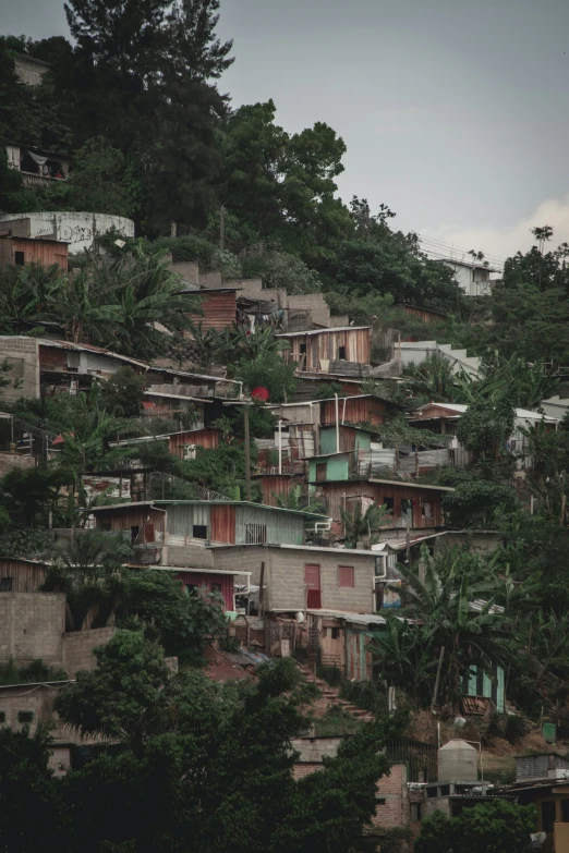 several old buildings and balconyes on the side of a hillside