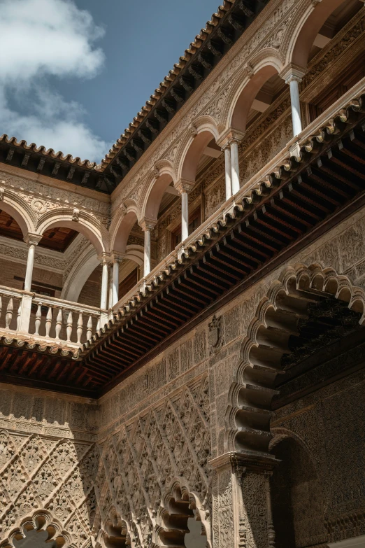 an ornate courtyard with arches and arches in a city