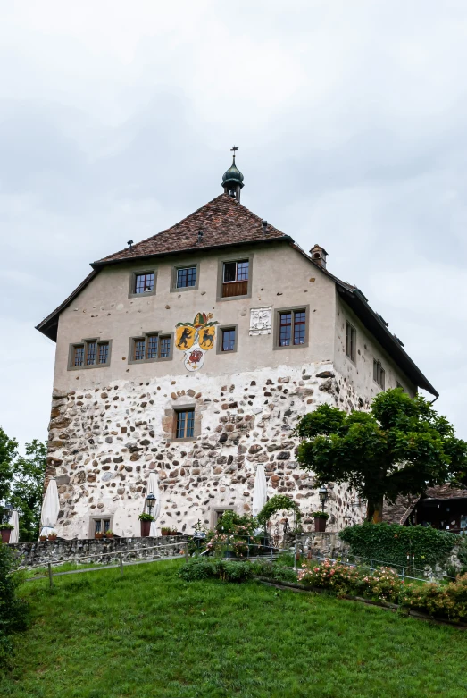 an old stone building with a clock at the top of it