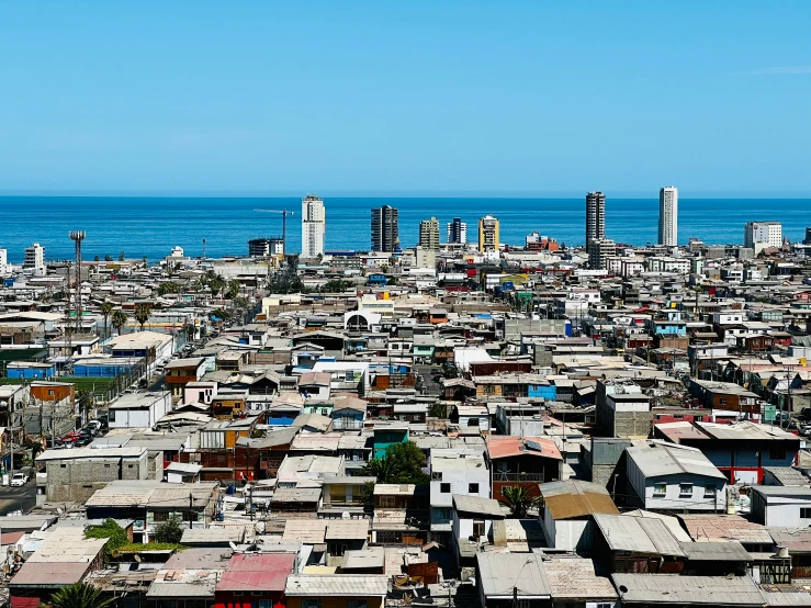 an aerial view of the city, including tall buildings and ocean