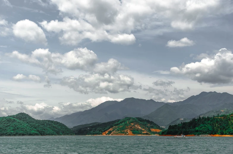 a small island surrounded by mountains and water