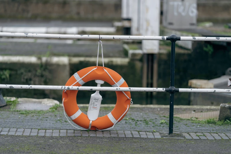 a life preserver hangs over a fence