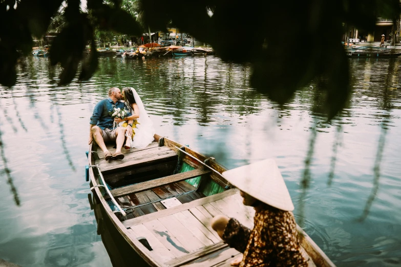 a person that is sitting on a boat in some water