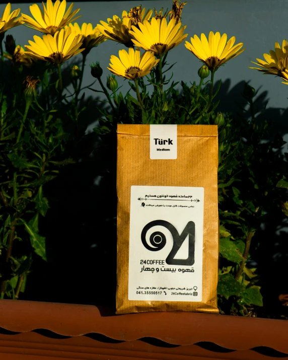 bags sitting on top of a roof covered in sunflowers