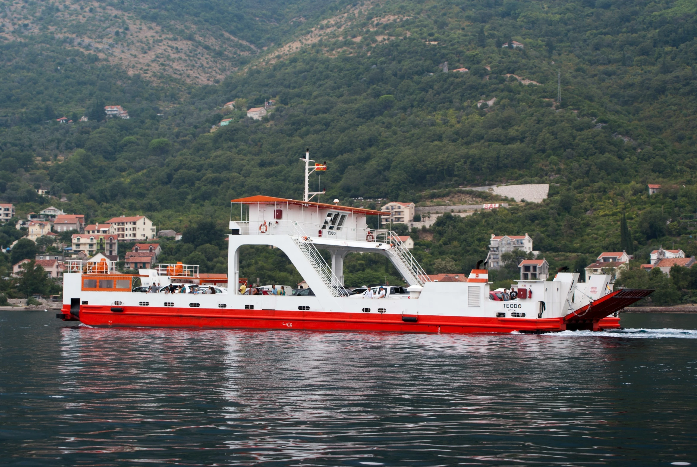 the red and white boat has paddles to paddle it