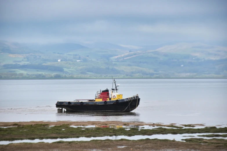 a large boat is anchored in the sea