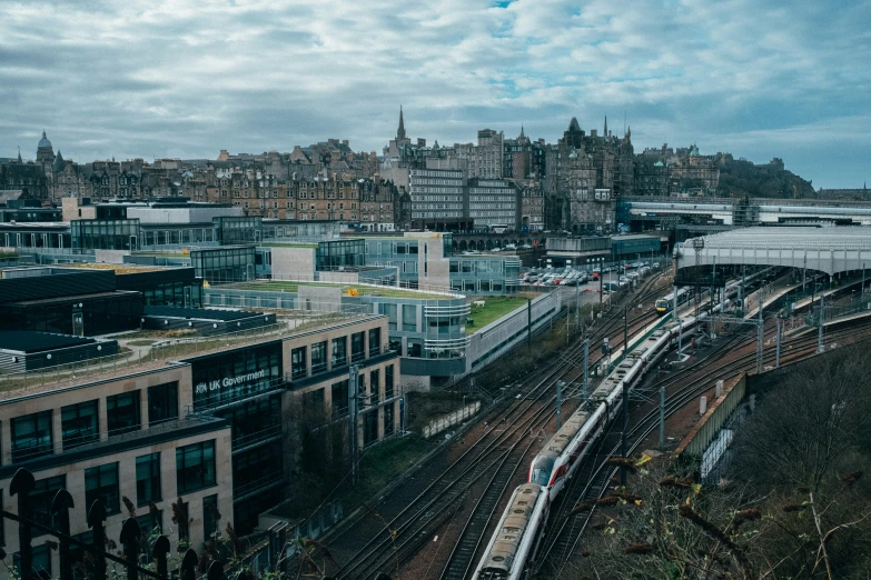 a train that is going by some buildings