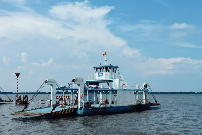 a ferry boat in the middle of a body of water