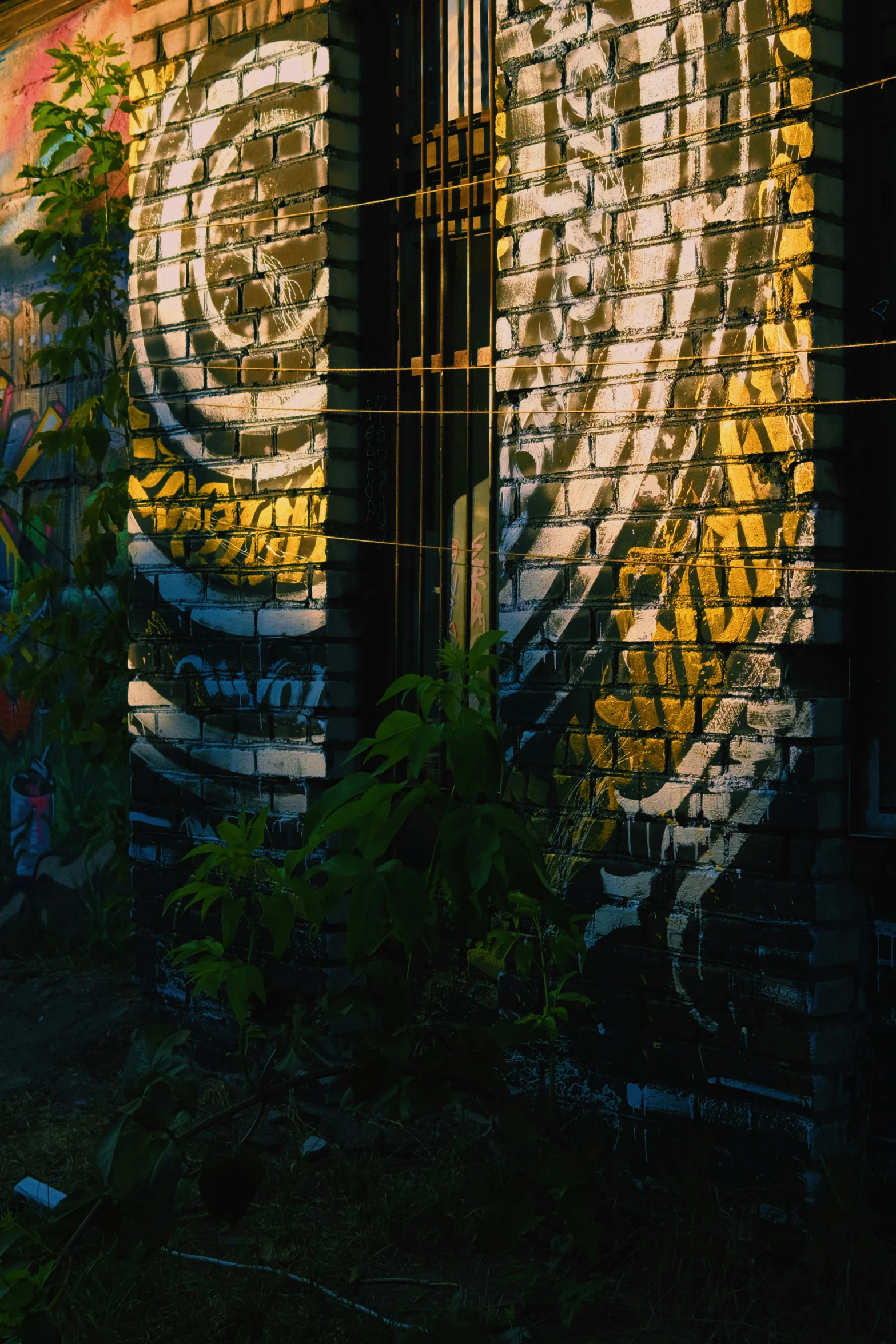 a graffiti covered building with a very big white piece of art