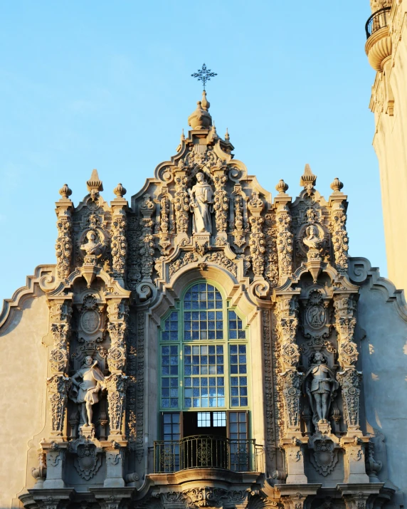 a tall building with ornate carved decorations on the front