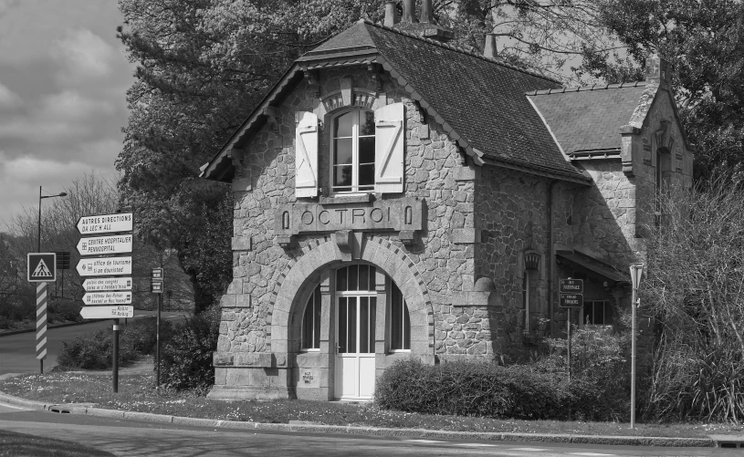 the house is old and vacant in black and white