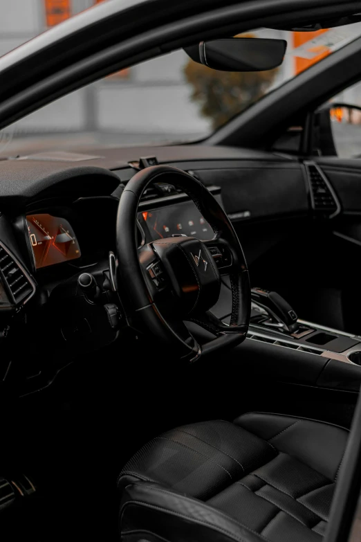 inside view of car dashboard with brown leather and black cloth