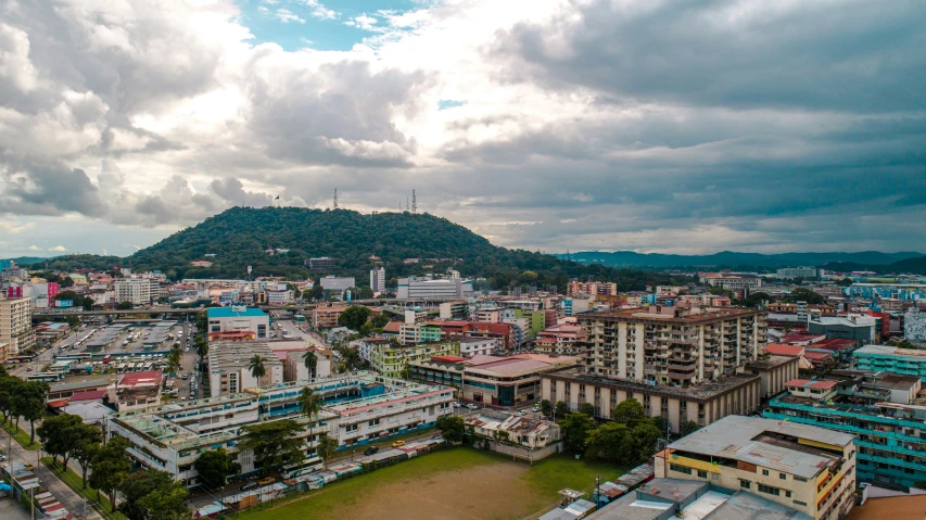 a big city area with mountains in the distance