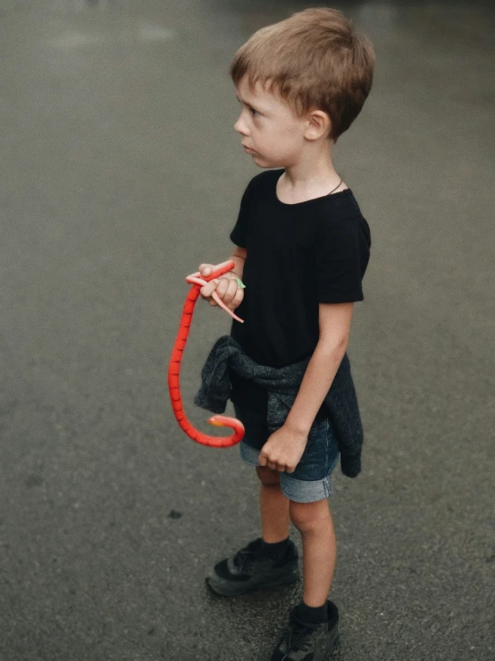 a  holding an umbrella over his head