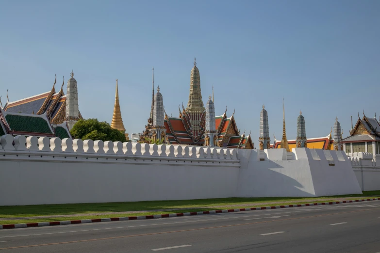 a very large fence in front of some buildings