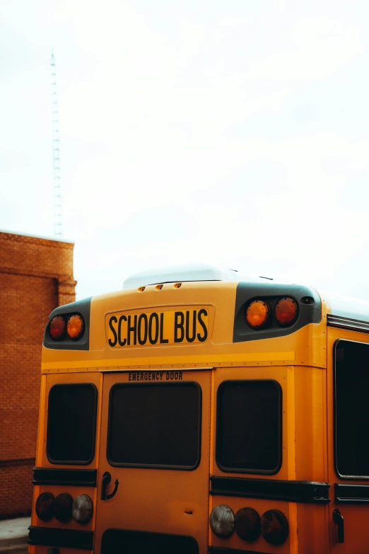 an old school bus sitting on the side of the street