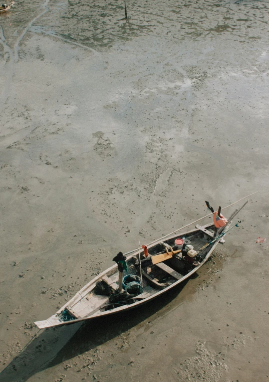 an empty boat with three people sitting on the front