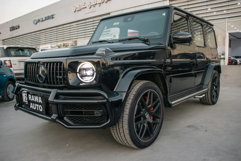 a mercedes benz benz - benz vehicle parked in front of an automotive dealership