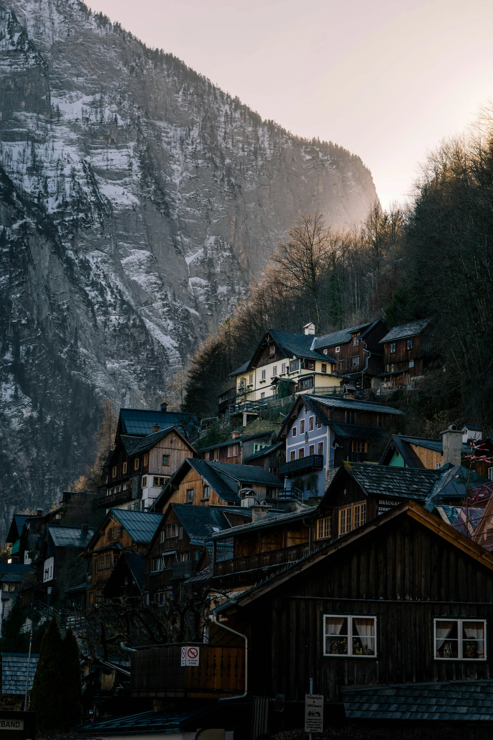a mountain village surrounded by forested hills