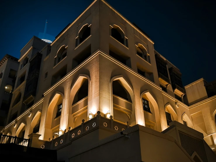 an intricately lit building is seen at night