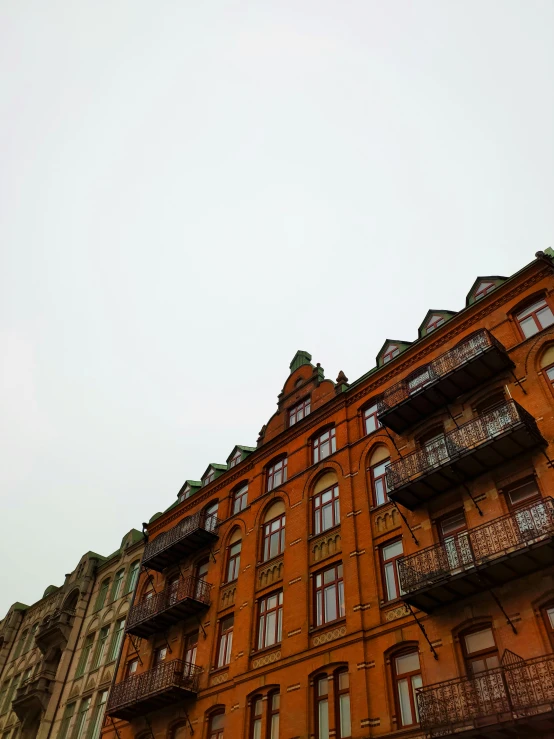 an ornate building with balconies on the sides