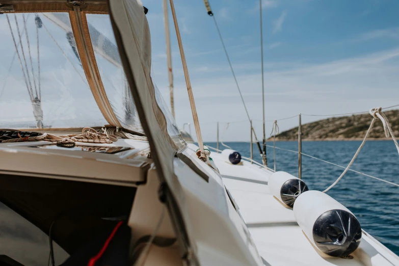 a large white boat sailing on top of a body of water