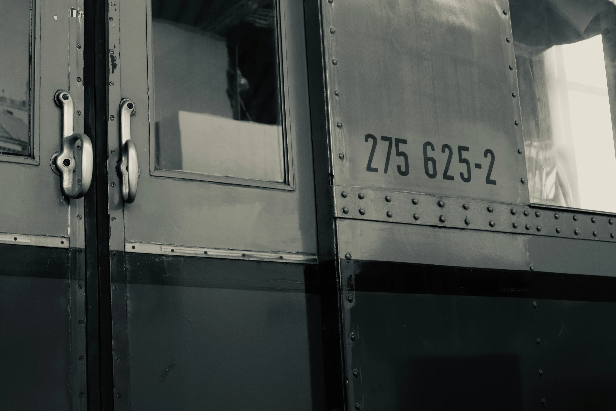 a black and white po of train doors