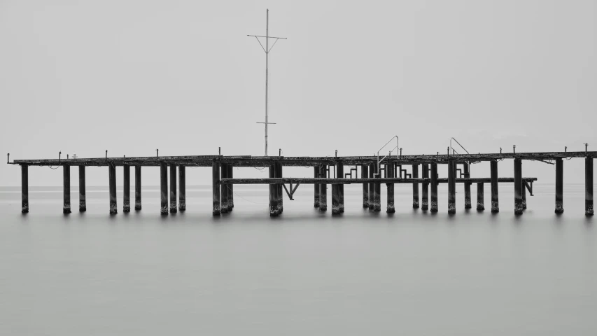 an empty dock with a very long pier