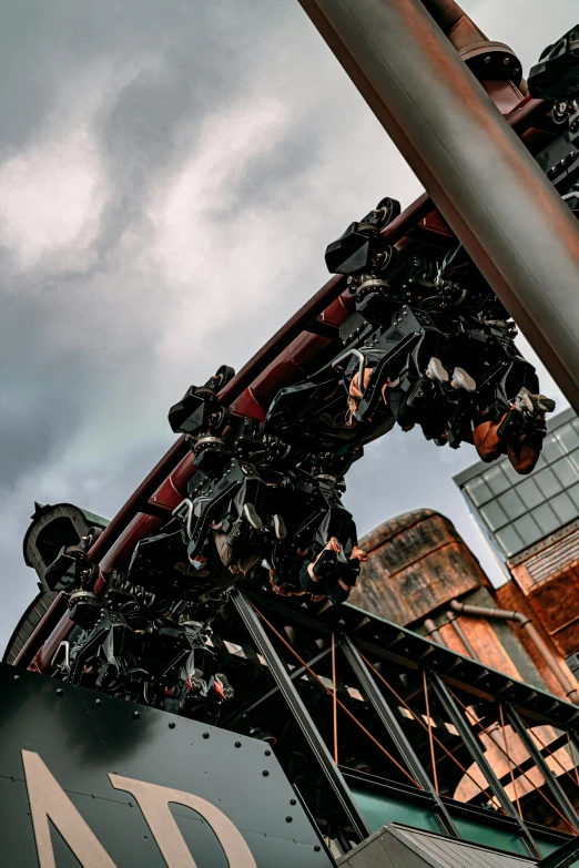 large metal structure over looking a large factory building