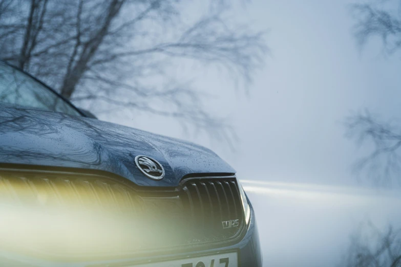 a car is covered in snow on a cold day