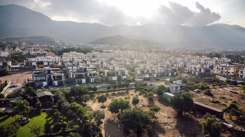 an aerial s of city with mountains in background