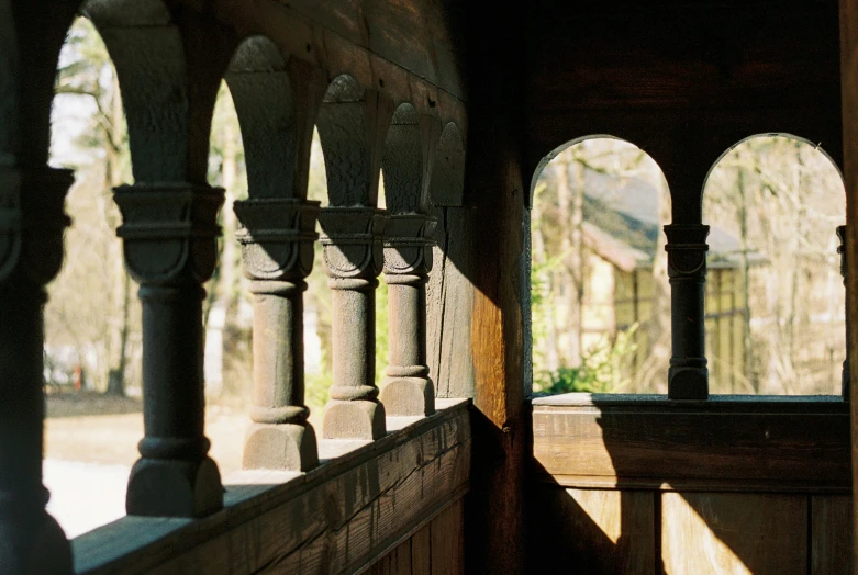 sunlight shines through the arches and arches on an old building