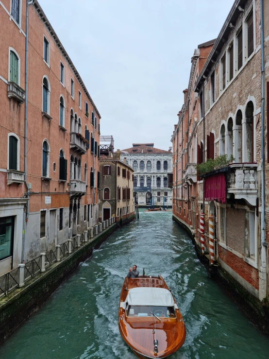 a view of a boat driving through the water