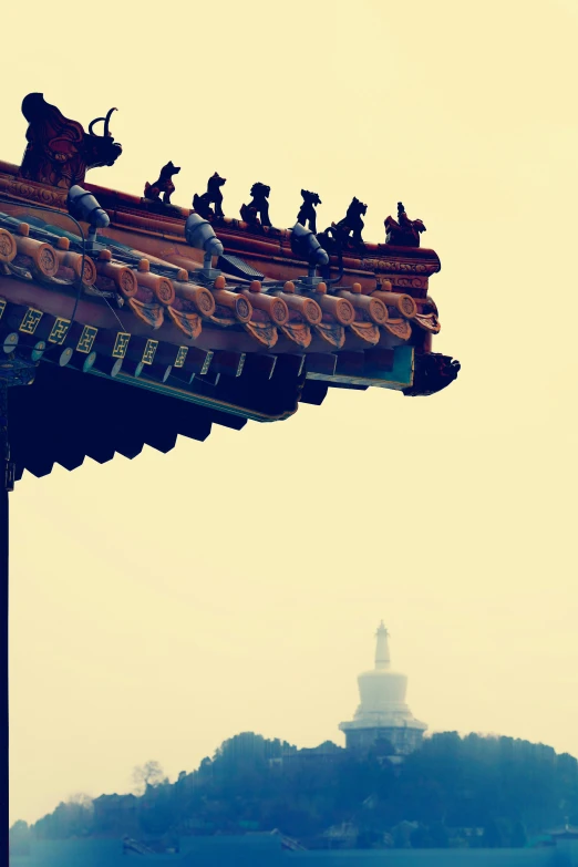 the top of a building with the pagoda tower in the background