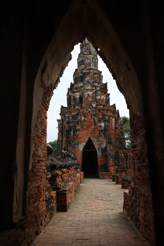 an archway leading to the inside of a temple