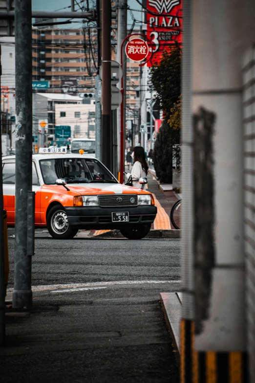 a red and white car is in the street