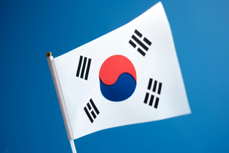 a white flag with black stripes that has the south korean flag on it